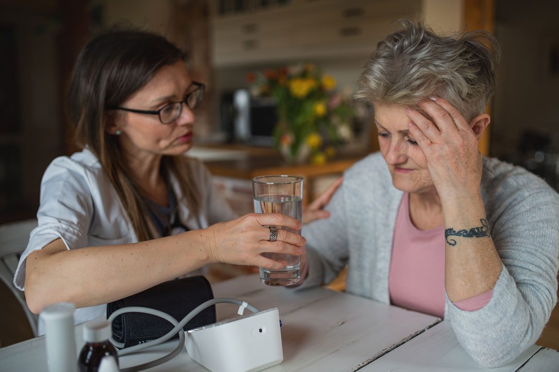 daughter helping senior mother